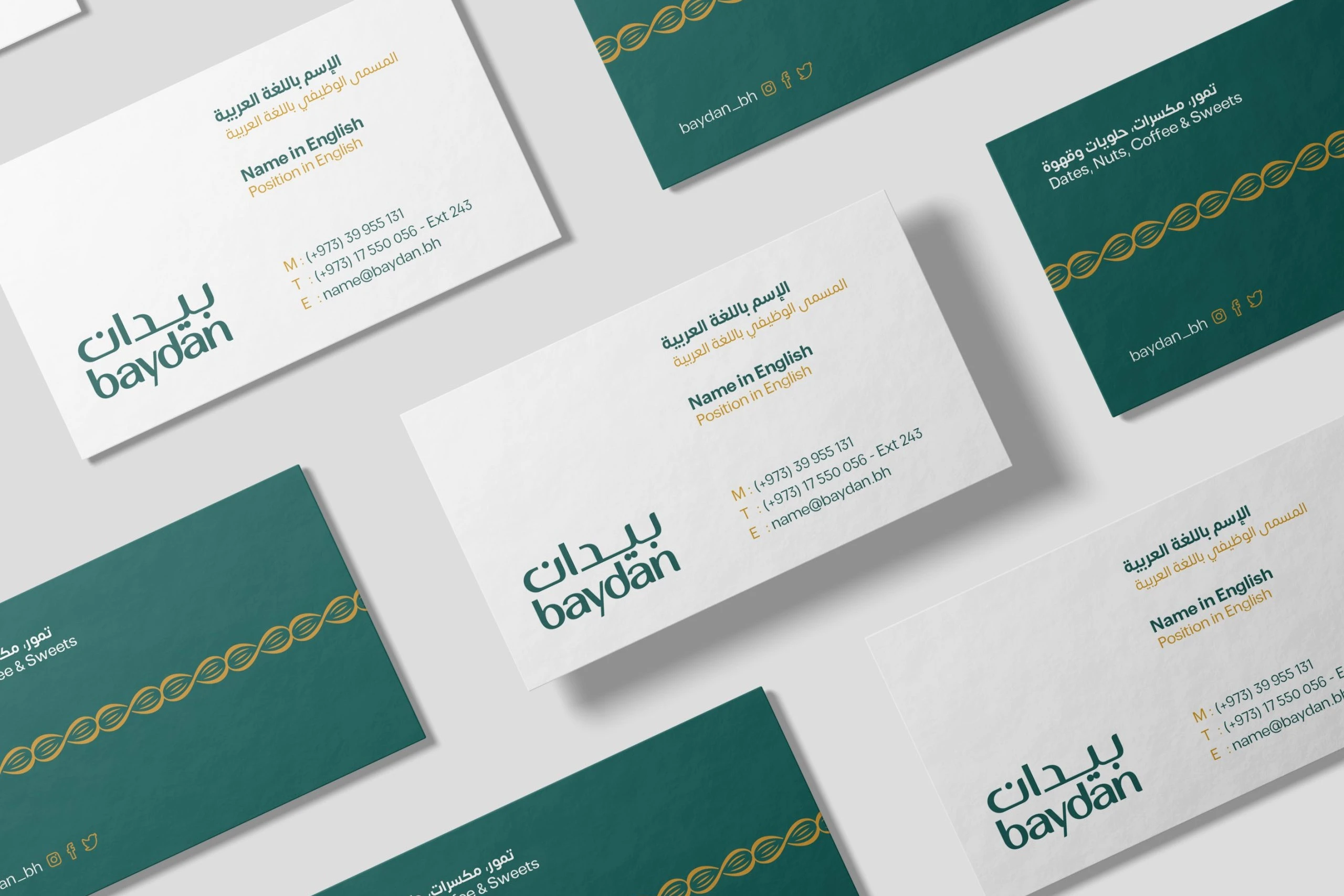 White and green business cards in rows: the logo and the holder's details on white, a band of gold almonds on green.