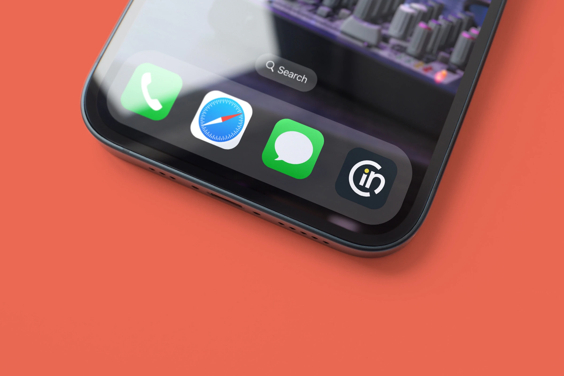A phone dock with the symbol as an app icon beside Phone, Safari and Messages, on coral.