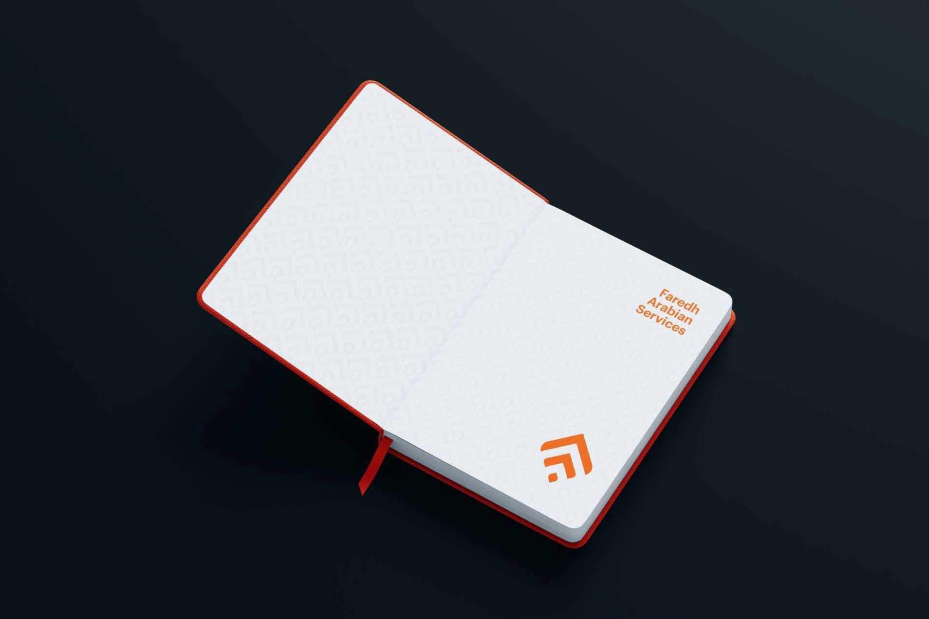 An open notebook with orange edges on dark navy: white pages with a faint repeat of the mark, and on the right page Faredh Arabian Services and the mark in orange.