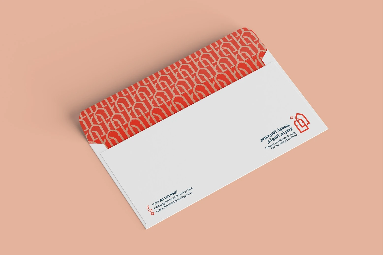 A white envelope with a coral arch-pattern flap and the logo, on pink.