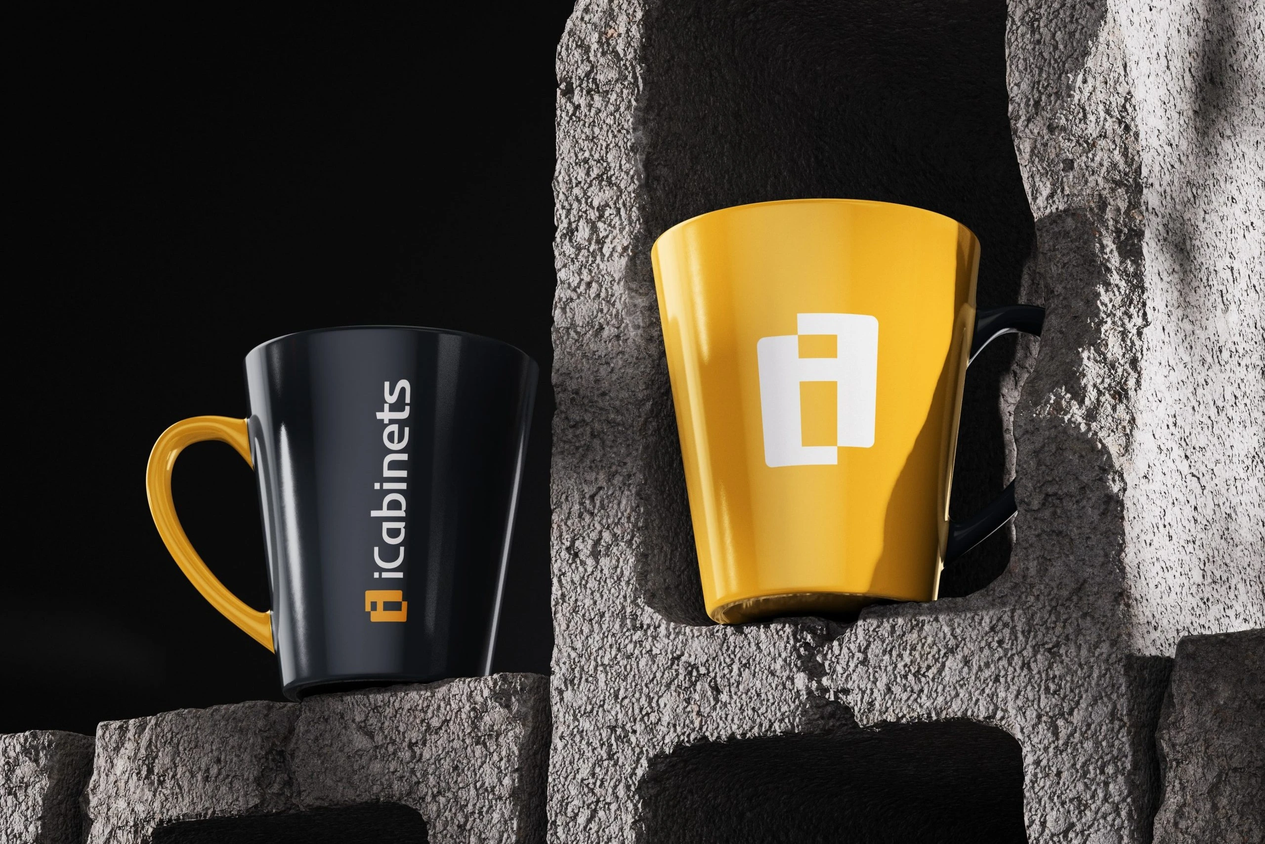 Two mugs on rough concrete blocks: a black mug with the iCabinets logo running up its side and a yellow handle, and a yellow mug with the white emblem and a black handle.