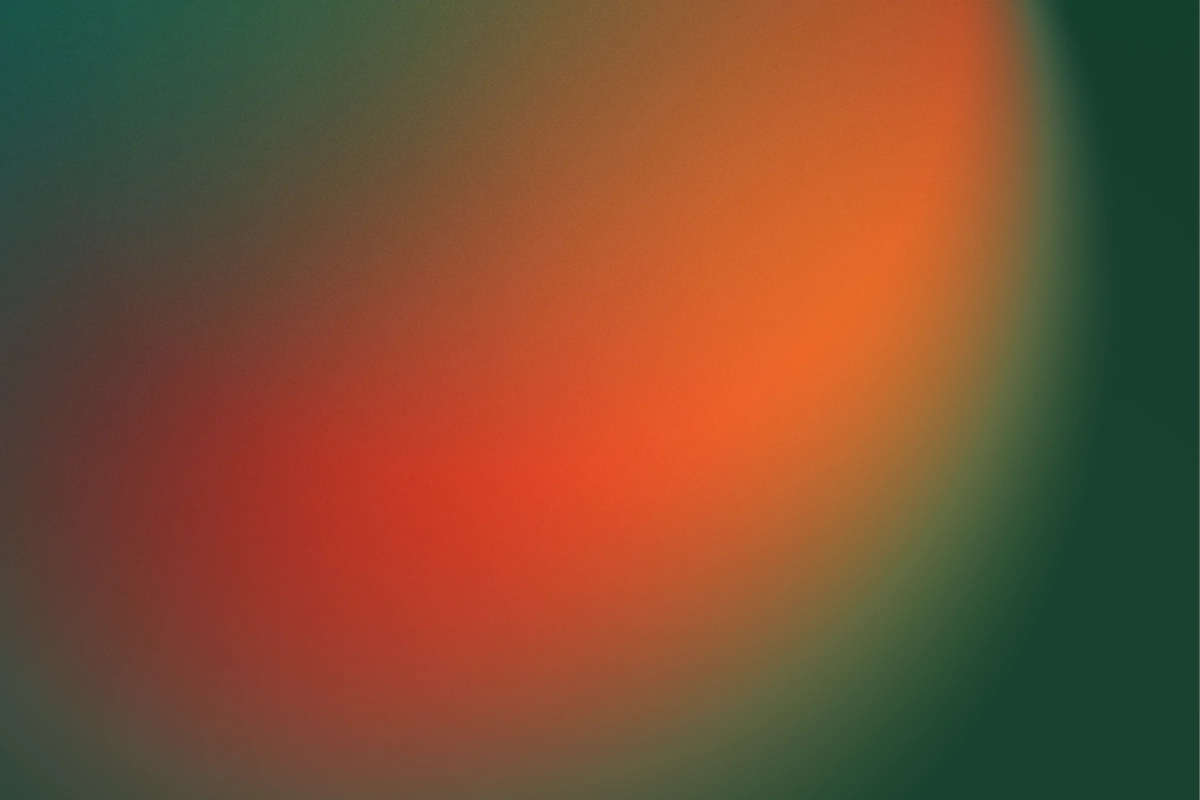 A grainy gradient: a glow of orange and red spreading across dark green.