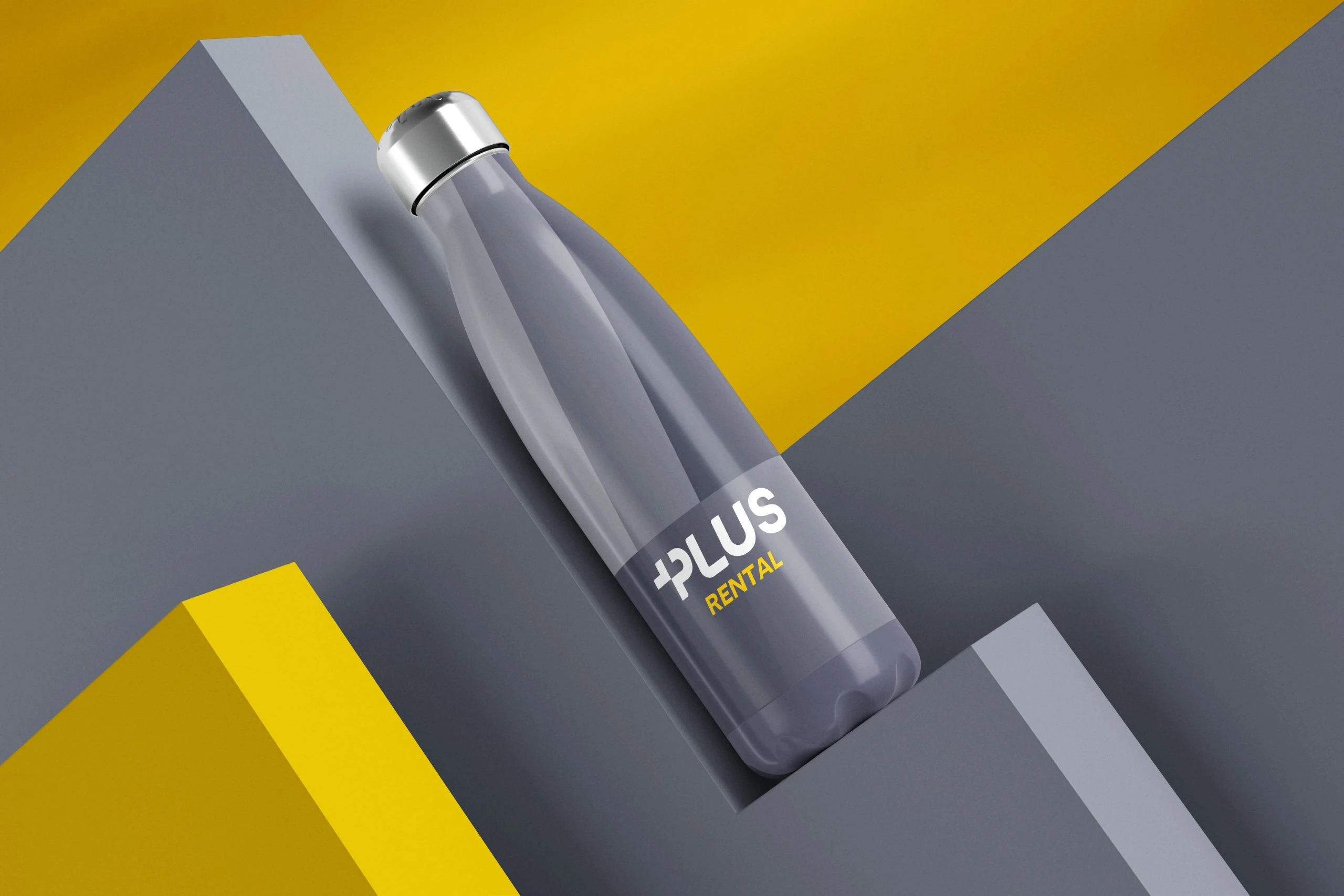A slate travel mug shaped like a bottle, with a steel cap and the Plus Rental logo, lying diagonally across stepped grey and yellow blocks.
