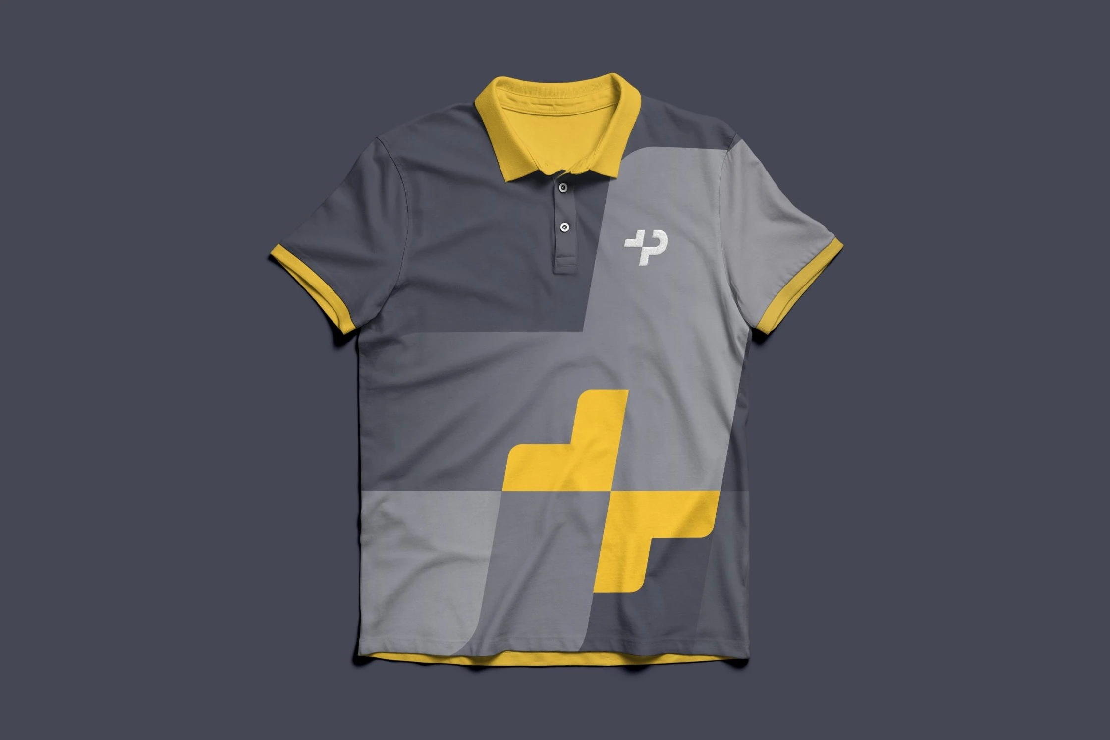 A two-tone grey polo shirt with a yellow collar and cuffs, the white P mark on the chest and a large yellow split plus across the front.
