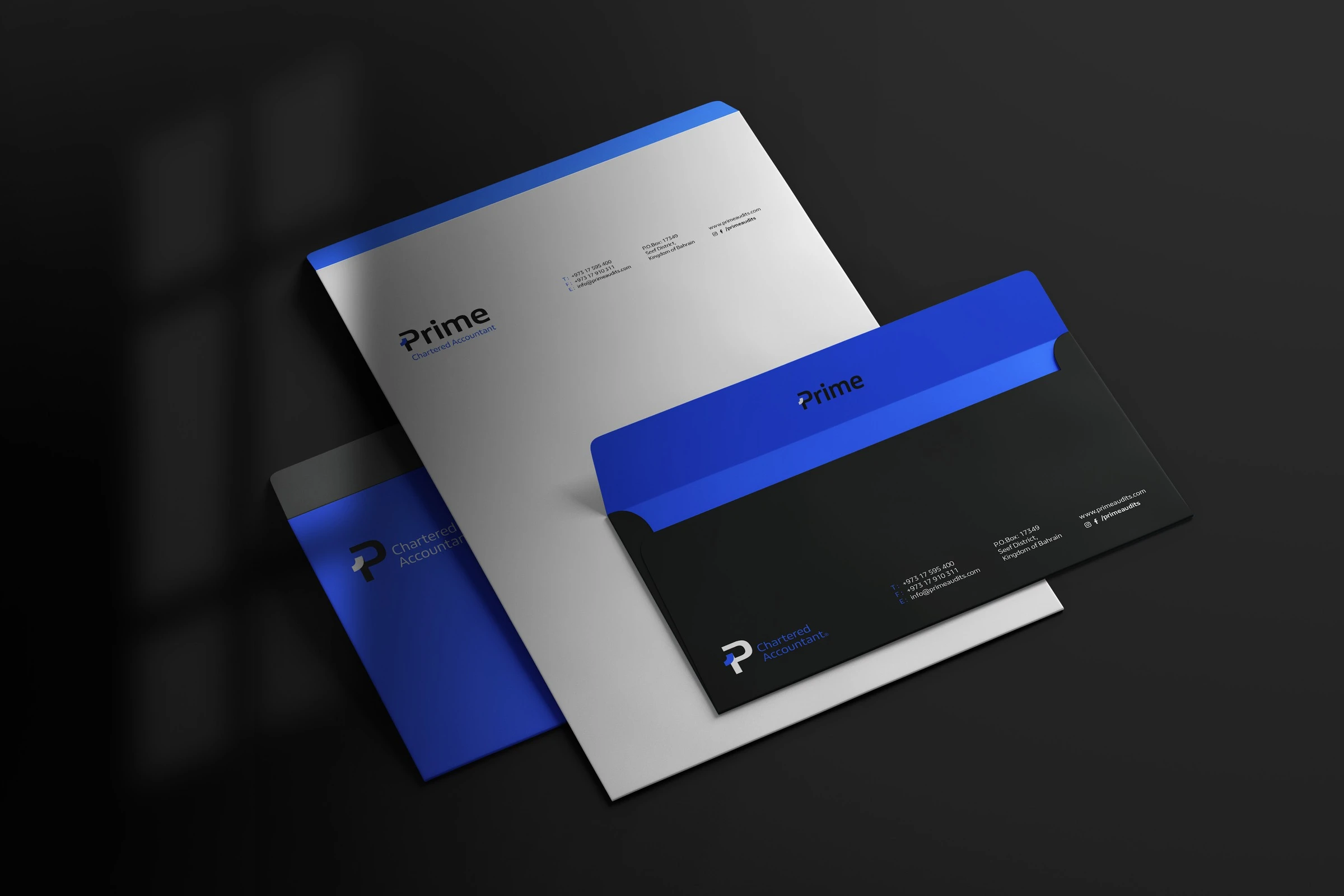 A white letterhead with a blue envelope and a black envelope with a blue flap, all carrying the Prime logo.