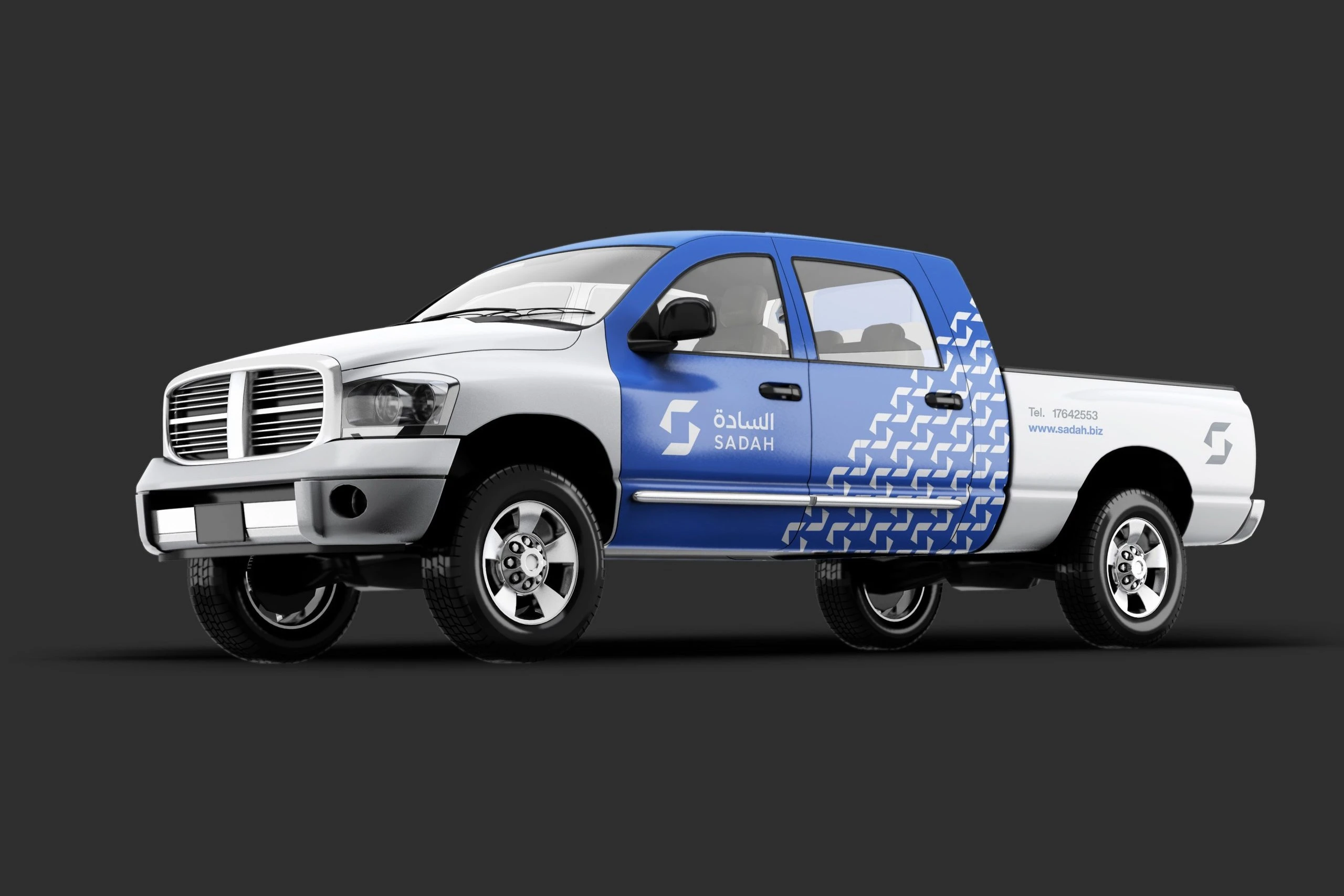 A white pickup truck with a blue side panel, the Sadah logo and the S pattern on the doors.