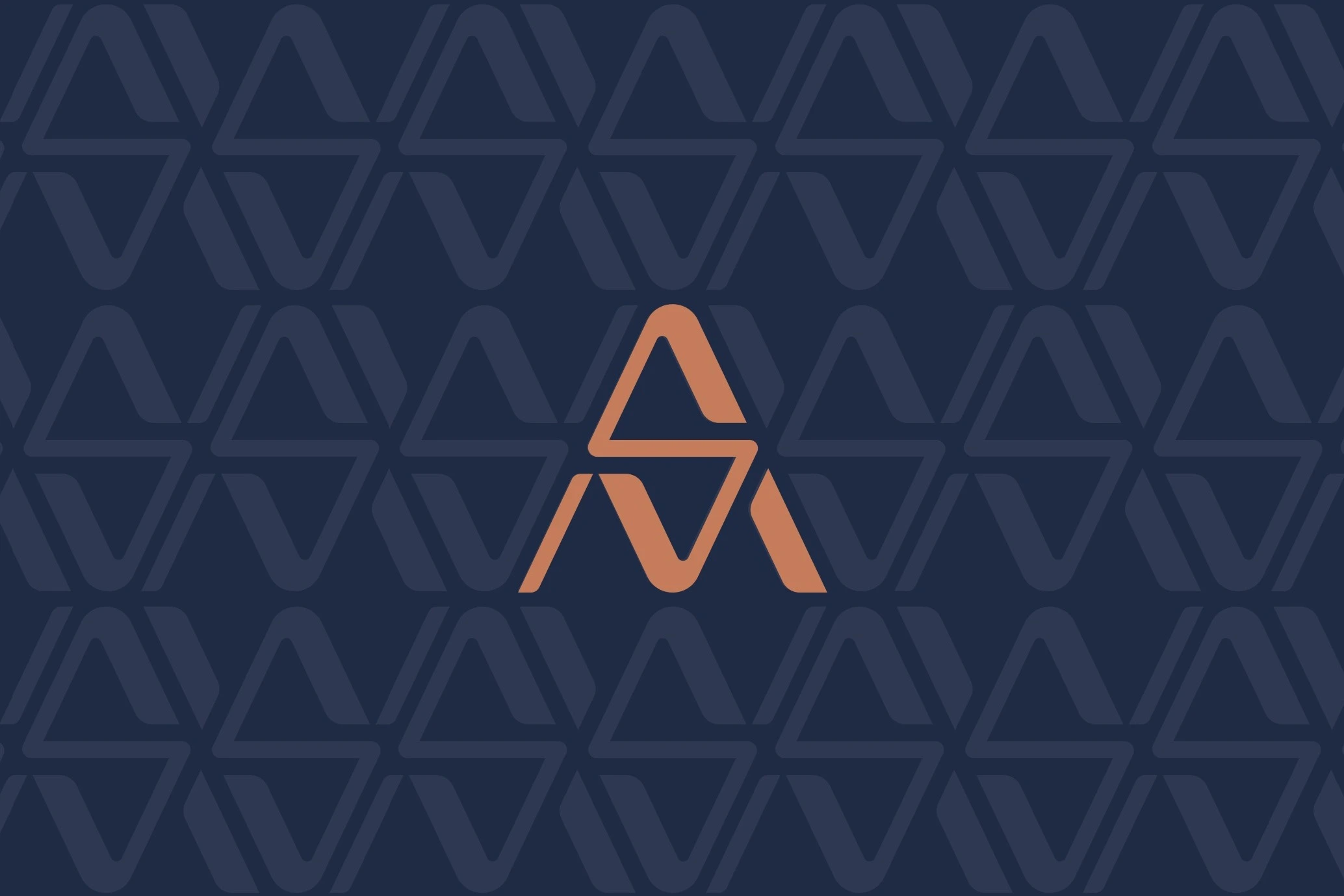 The back of the business card: the copper monogram centred on navy, over the triangle pattern in a slightly lighter navy.