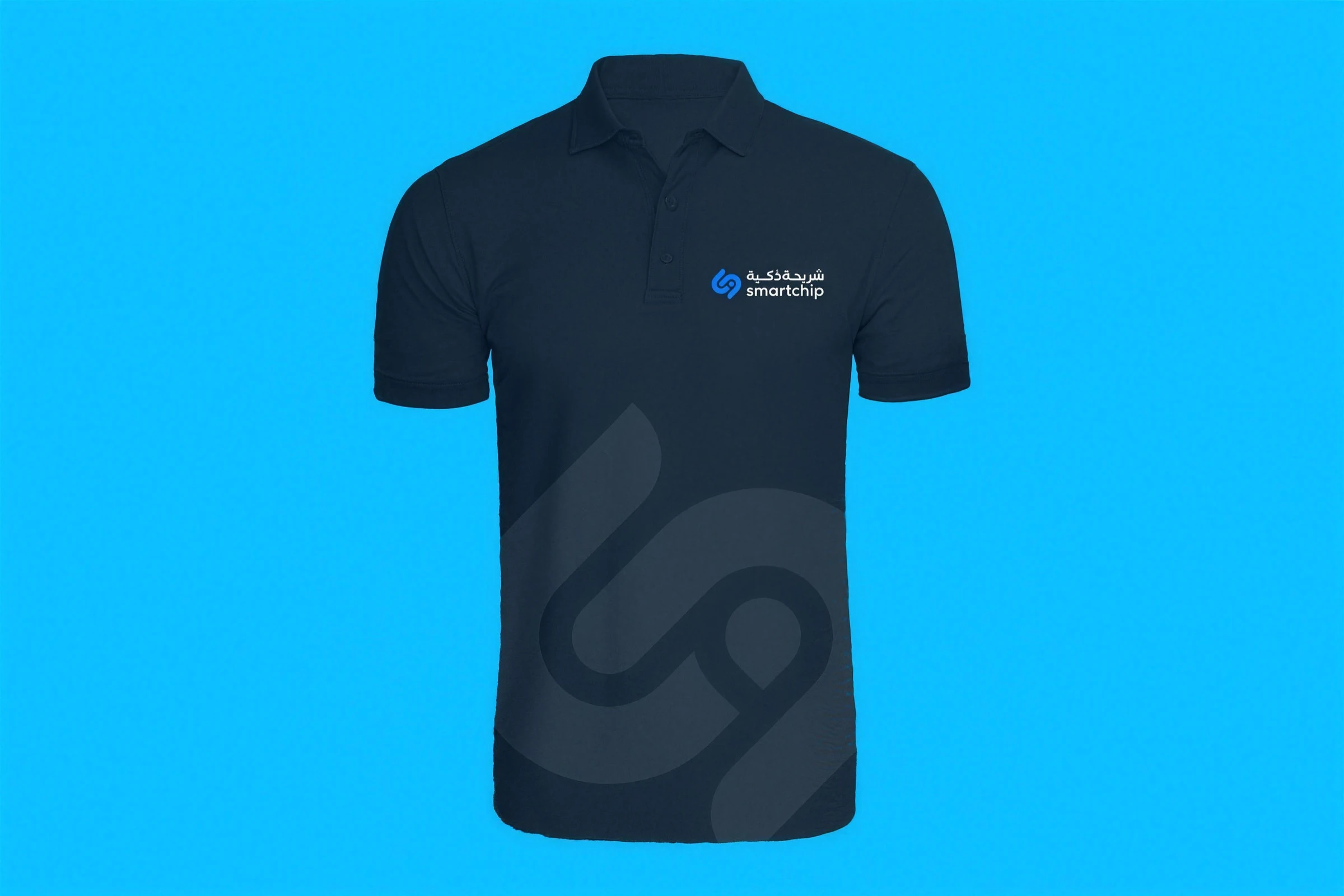 A dark blue polo shirt with the Smart Chip logo on the chest and a large, faint monogram across the front, on light blue.