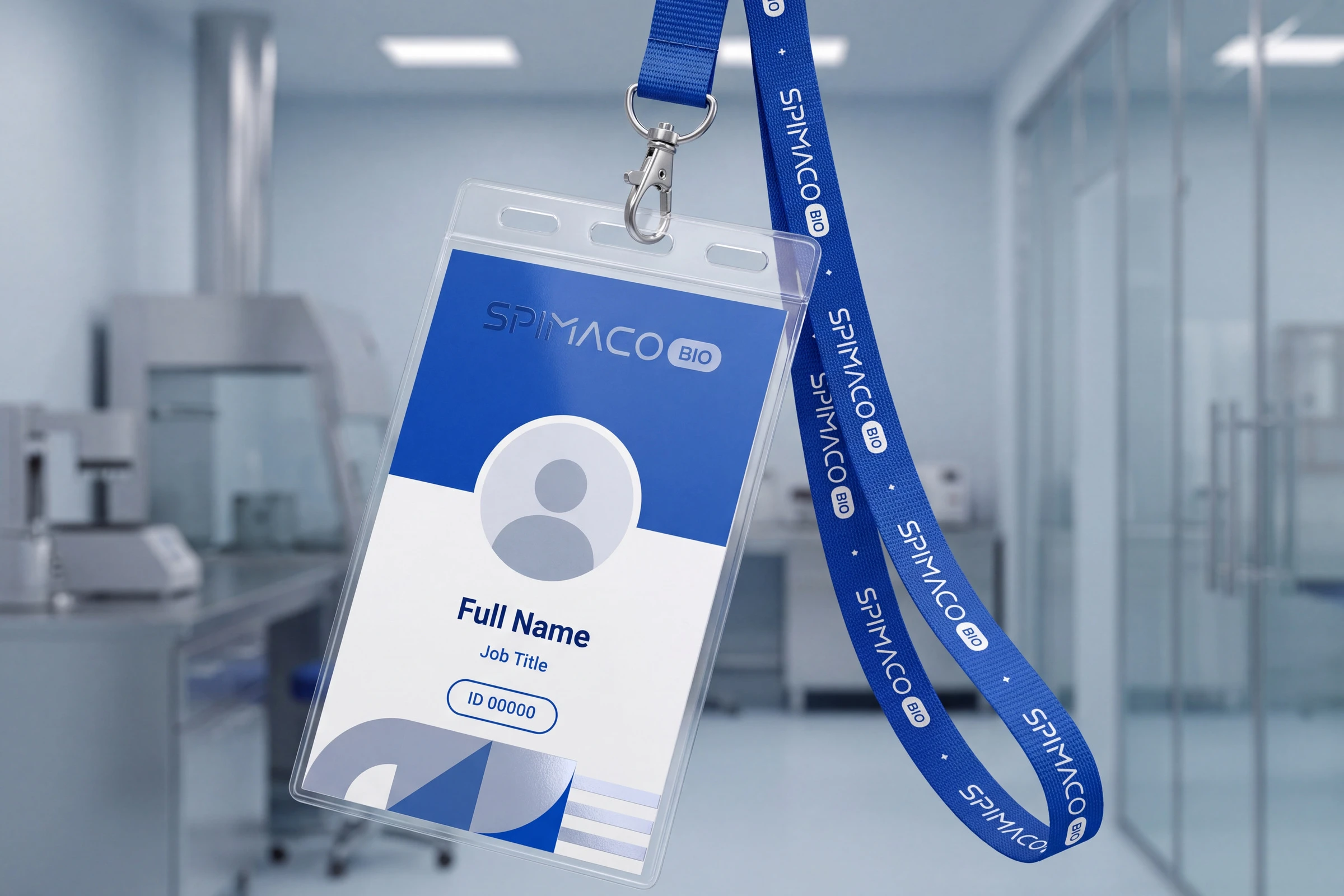 A staff ID in a clear holder on a blue lanyard printed with the wordmark, the card blue above and white below with a photo circle, Full Name, Job Title and ID 00000, in a laboratory.